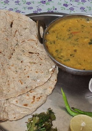 A picture of Methi pithla jowar green garlic bhakri and thecha village style.