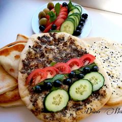 A picture of Manaich zaater (thyme) & cheese, Lebanese pizza,.
