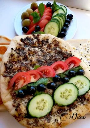 A picture of Manaich zaater (thyme) & cheese, Lebanese pizza,.