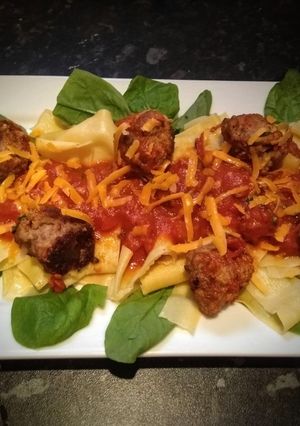 A picture of Home made Meatballs, Pasta & tomato sauce.
