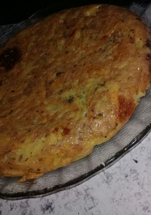 Una foto de Tortilla de papas con queso cremoso