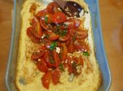Una foto de tomate cherry queso cabra