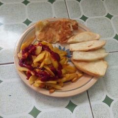 A picture of Fried yam,fried irish with fried egg.