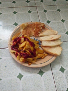 A picture of Fried yam,fried irish with fried egg.