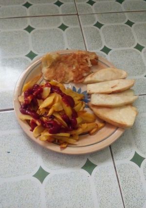 A picture of Fried yam,fried irish with fried egg.