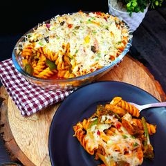 A picture of Baked Cheesy Pasta with Tomato, Basil and Veggies.