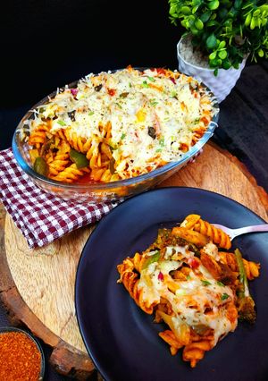 A picture of Baked Cheesy Pasta with Tomato, Basil and Veggies.