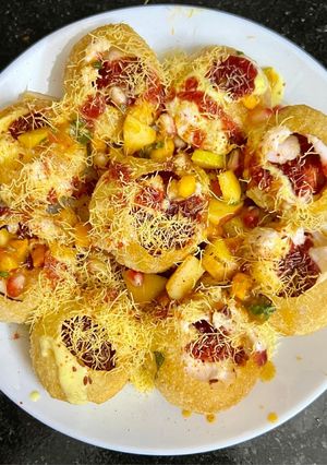 A picture of Fruity dahi poori with flavored Greek dahi & plum chutney.