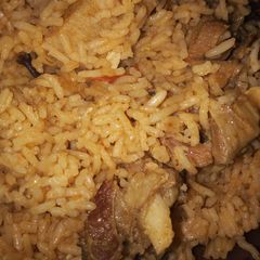 A picture of Beef pilau with kachumbari.