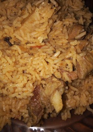 A picture of Beef pilau with kachumbari.