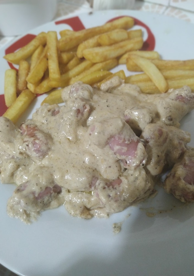 Una foto de Salchichas con salsa de queso