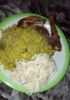 A picture of Fried rice and chicken.