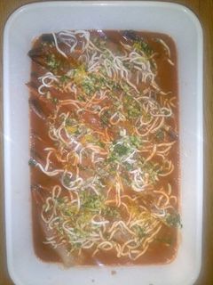 Una foto de Langostinos en su jugo, al horno