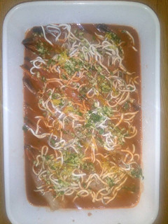 Una foto de Langostinos en su jugo, al horno
