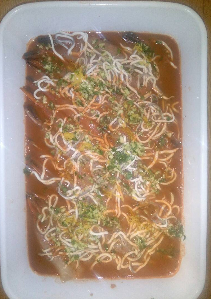 Una foto de Langostinos en su jugo, al horno