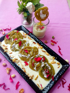 A picture of Spinach jalebi with nutty cheese rabdi.