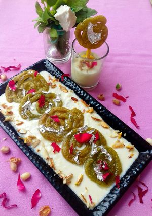 A picture of Spinach jalebi with nutty cheese rabdi.