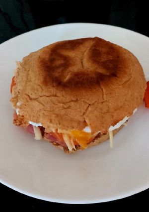 A picture of My Bacon,Tom,Cheese+Poached Egg Muffin 🥰#Breakfast.