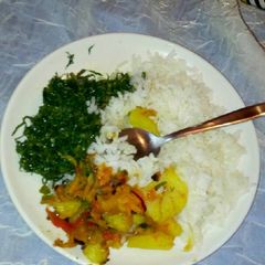 A picture of Stewed potatoes served with Rice.