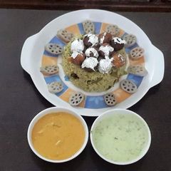 A picture of Haryali moti biryani with haryali raita.
