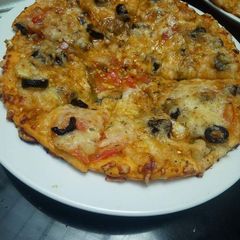A picture of Cheesy tasty pizza.