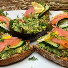 A picture of Bruschetta with Guacamole and Salmon.
