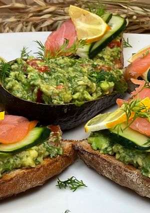 A picture of Bruschetta with Guacamole and Salmon.