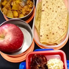 A picture of Ajwain paratha and aloo baingan sabzi.
