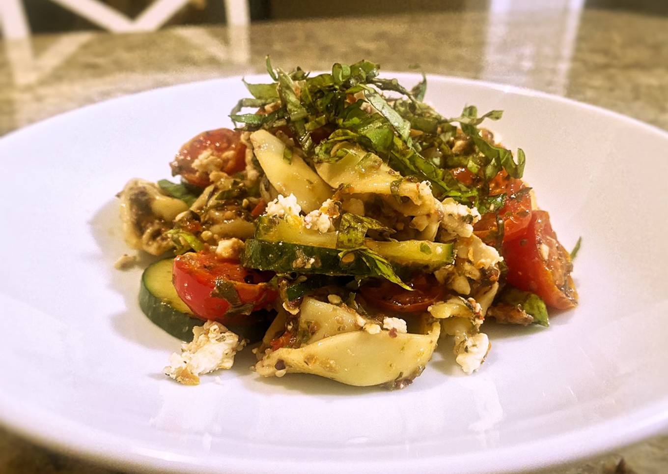 Tortellini olive tapenade with marinated tomatoes and cucumbers
