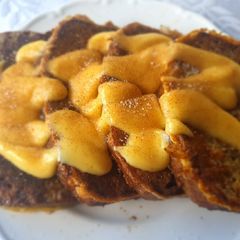 A picture of Breakfast pudding, Banana bread french toast and custard.