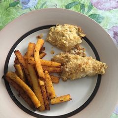 A picture of Fish and chips with polenta fries.