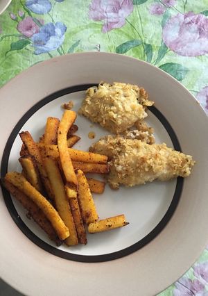 A picture of Fish and chips with polenta fries.