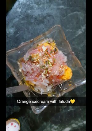 A picture of Orange ice cream with faluda.