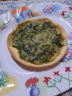 Una foto de Tarteletas de acelga y salsa blanca