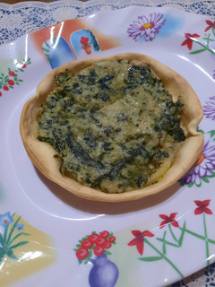 Una foto de Tarteletas de acelga y salsa blanca