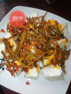 A picture of Boiled yam and ugba sauce (African oil-bean seed).
