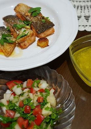 A picture of Salmon fish steak with fresh salad and lemon sauce. #mycookbook.