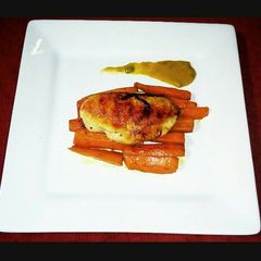 Grilled Chicken with Braised Flavoured Carrots and Tumeric Sauce A picture of Grilled Chicken with Braised Flavoured Carrots and Tumeric Sauce.