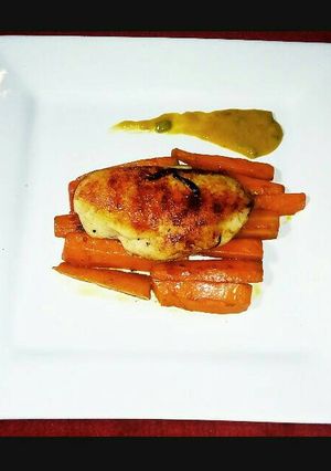 A picture of Grilled Chicken with Braised Flavoured Carrots and Tumeric Sauce.