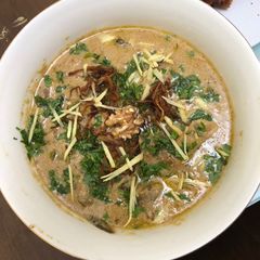 A picture of Adraki akhroti mutton(Mutton curry with ginger and walnut).
