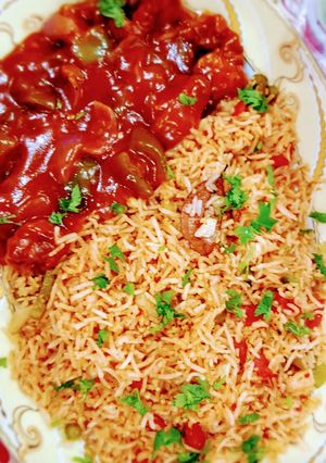 A picture of Chicken Manchurian with vegetable rice.