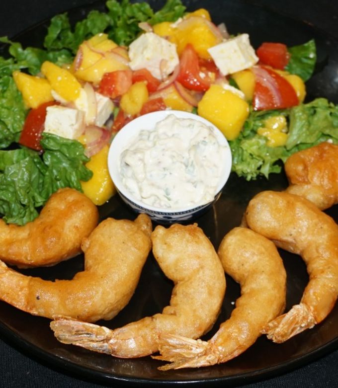 A picture of Beer-Battered Fried Shrimp with Mango and Goat Cheese Salad.