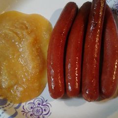 A picture of Hotdogs with applesauce.