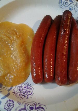 A picture of Hotdogs with applesauce.