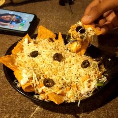 Nachos with cheese sauce A picture of Nachos with cheese sauce.