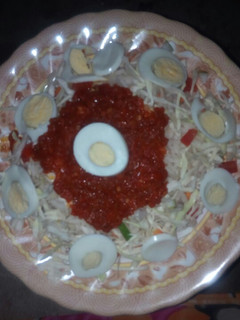 A picture of White rice and stew with eggs and cabbage.