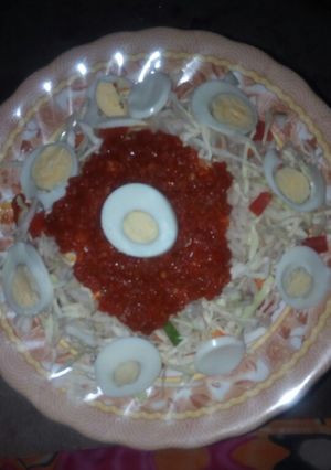 A picture of White rice and stew with eggs and cabbage.