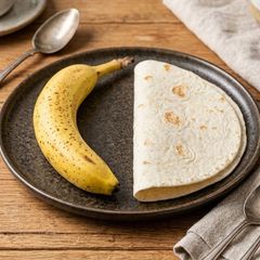 A picture of Banana Tortilla W/ Nutella & Peanut Butter.