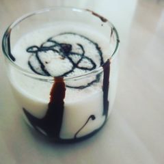 A picture of Chocolate syrup Dahi lassi.