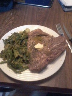 A picture of T-Bone Steak w/Lemon Herb Butter and Vegetable Medley.